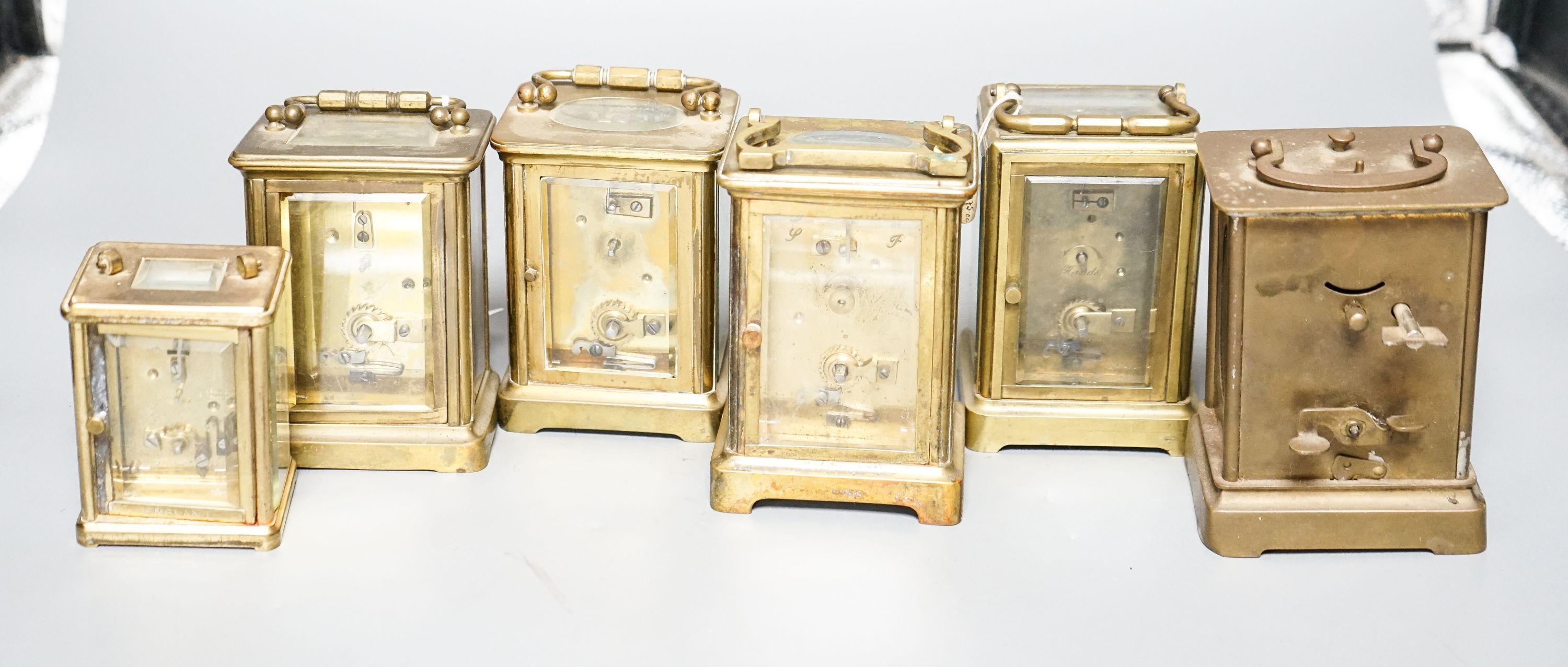 Six assorted carriage timepieces, one with alarm